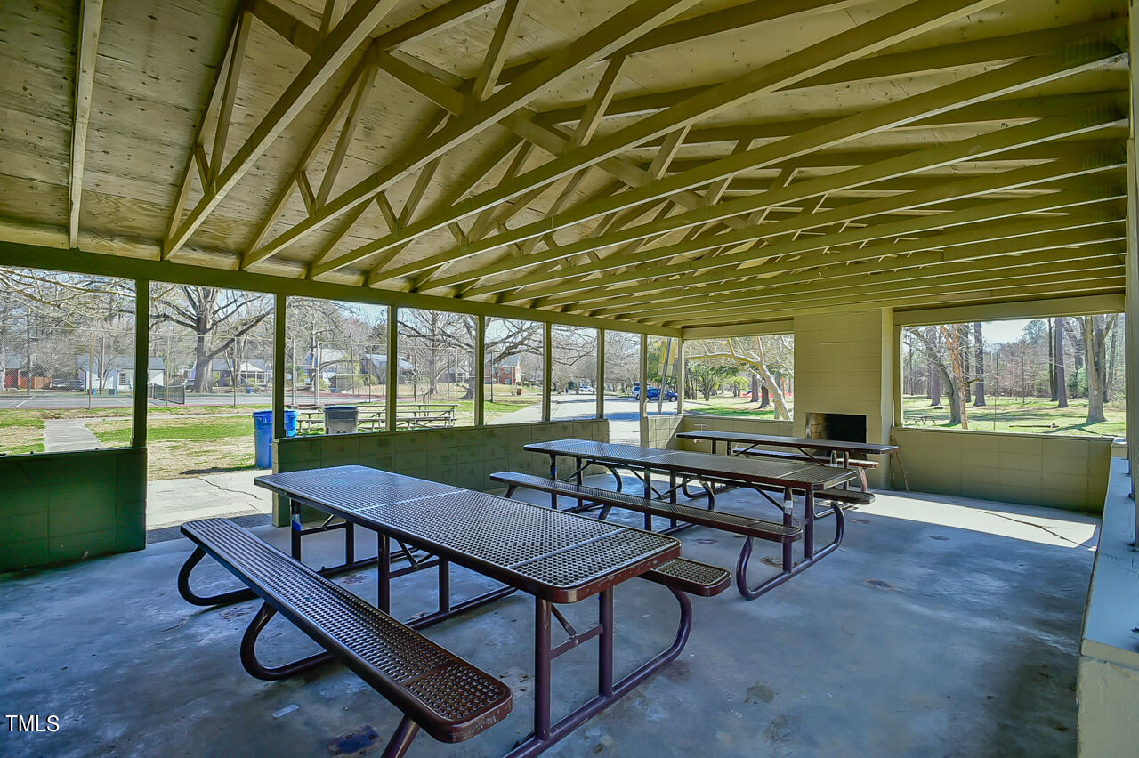 2411 Farthing Street Durham, NC 27704 - Photo 47 of 47 a view of a patio with a table chairs and a backyard