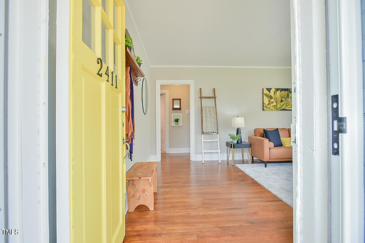 2411 Farthing Street Durham, NC 27704 - Photo 7 of 47 a living room with furniture and a wooden floor