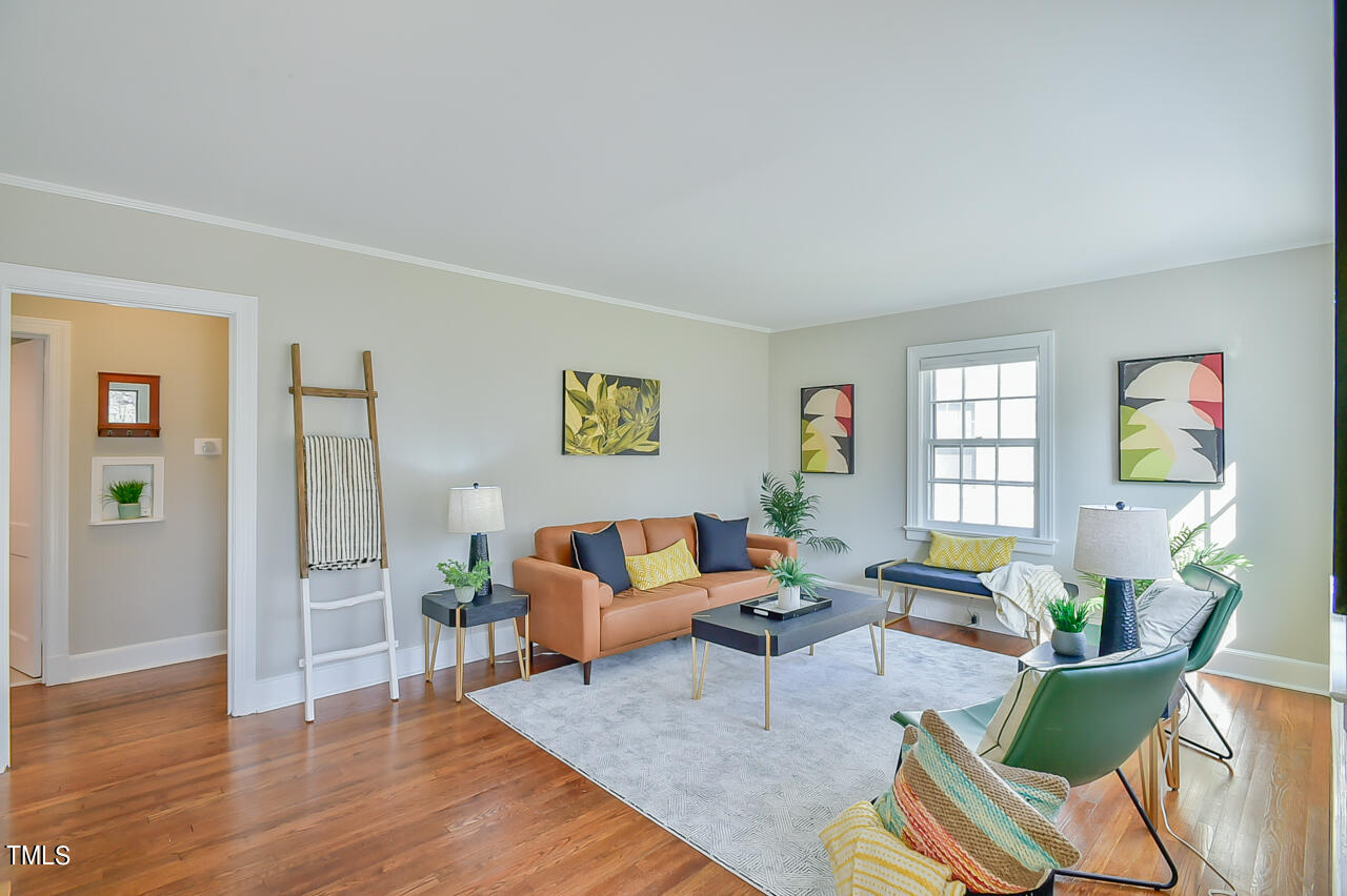 2411 Farthing Street Durham, NC 27704 - Photo 8 of 47 a living room with furniture and wooden floor