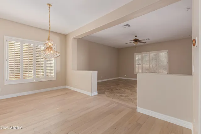 a kitchen with granite countertop white cabinets and stainless steel appliances