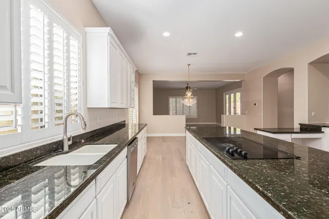 a kitchen with a sink and cabinets