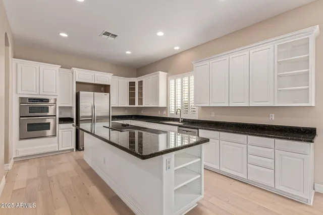 a bathroom with a sink a mirror and vanity