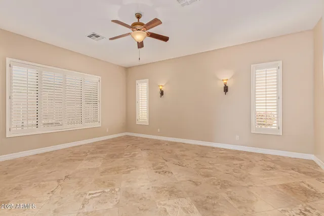 a spacious bathroom with a granite countertop tub sink and mirror