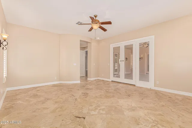 a large white bathroom with a double vanity sink a mirror and a bathtub