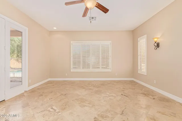 a bathroom with a tub shower sink and mirror