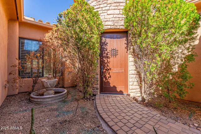 a view of a chairs and table in patio