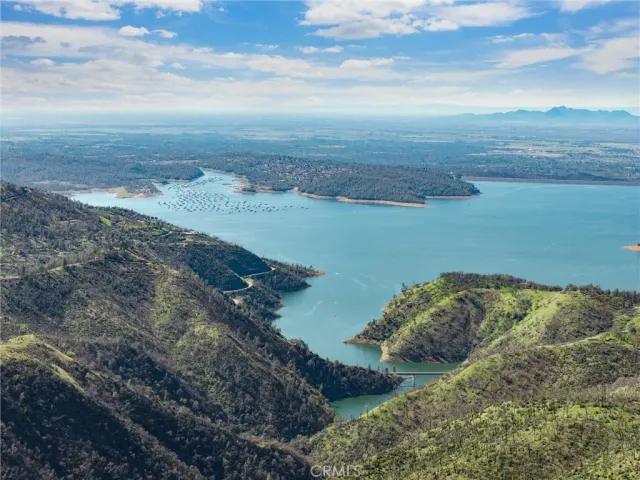 a view of a lake with a yard