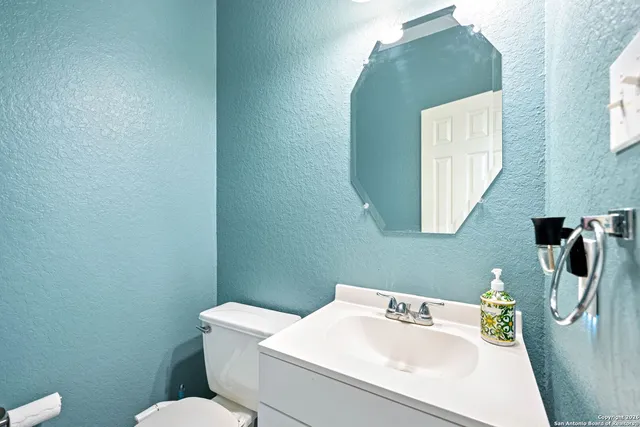 a bedroom with furniture and wooden floor