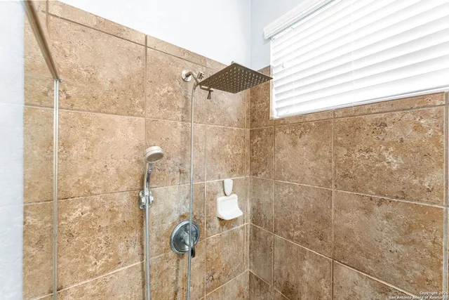 a view of a dining room with furniture and window
