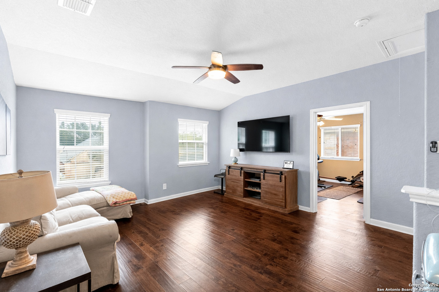 13119 Moselle Forest Helotes, TX 78023 - Photo 25 of 38 a living room with furniture and a flat screen tv