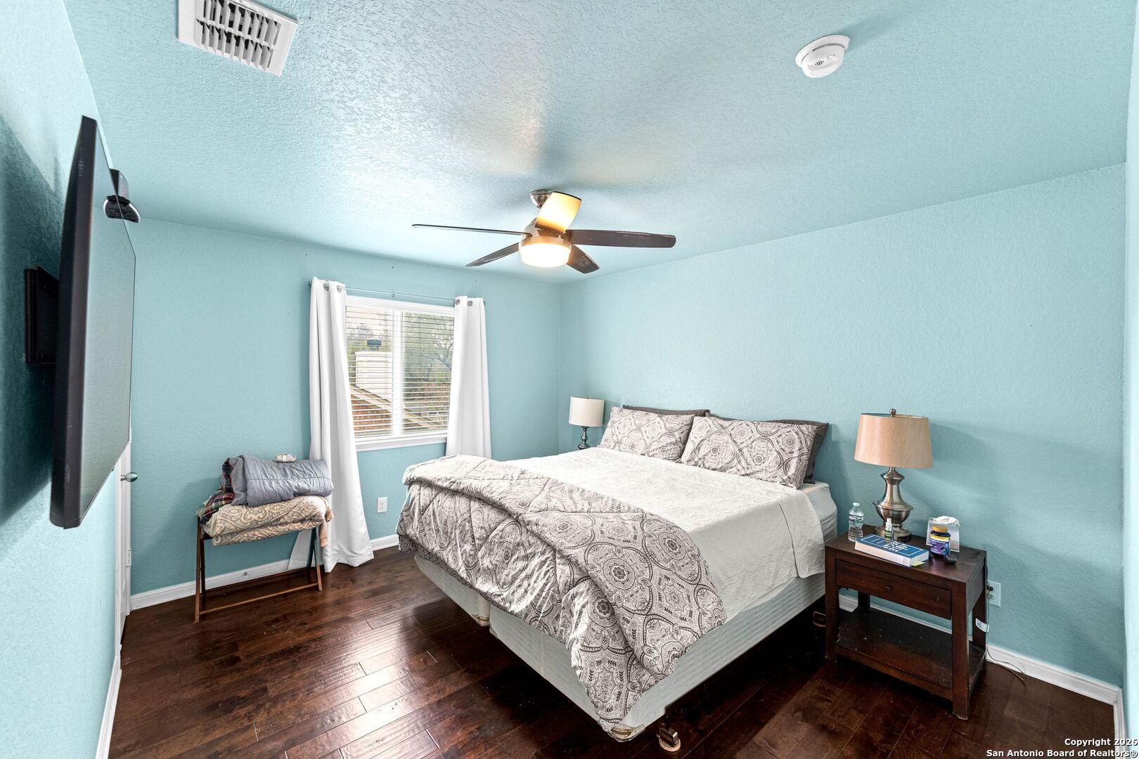 13119 Moselle Forest Helotes, TX 78023 - Photo 32 of 38 a bedroom with a bed and window