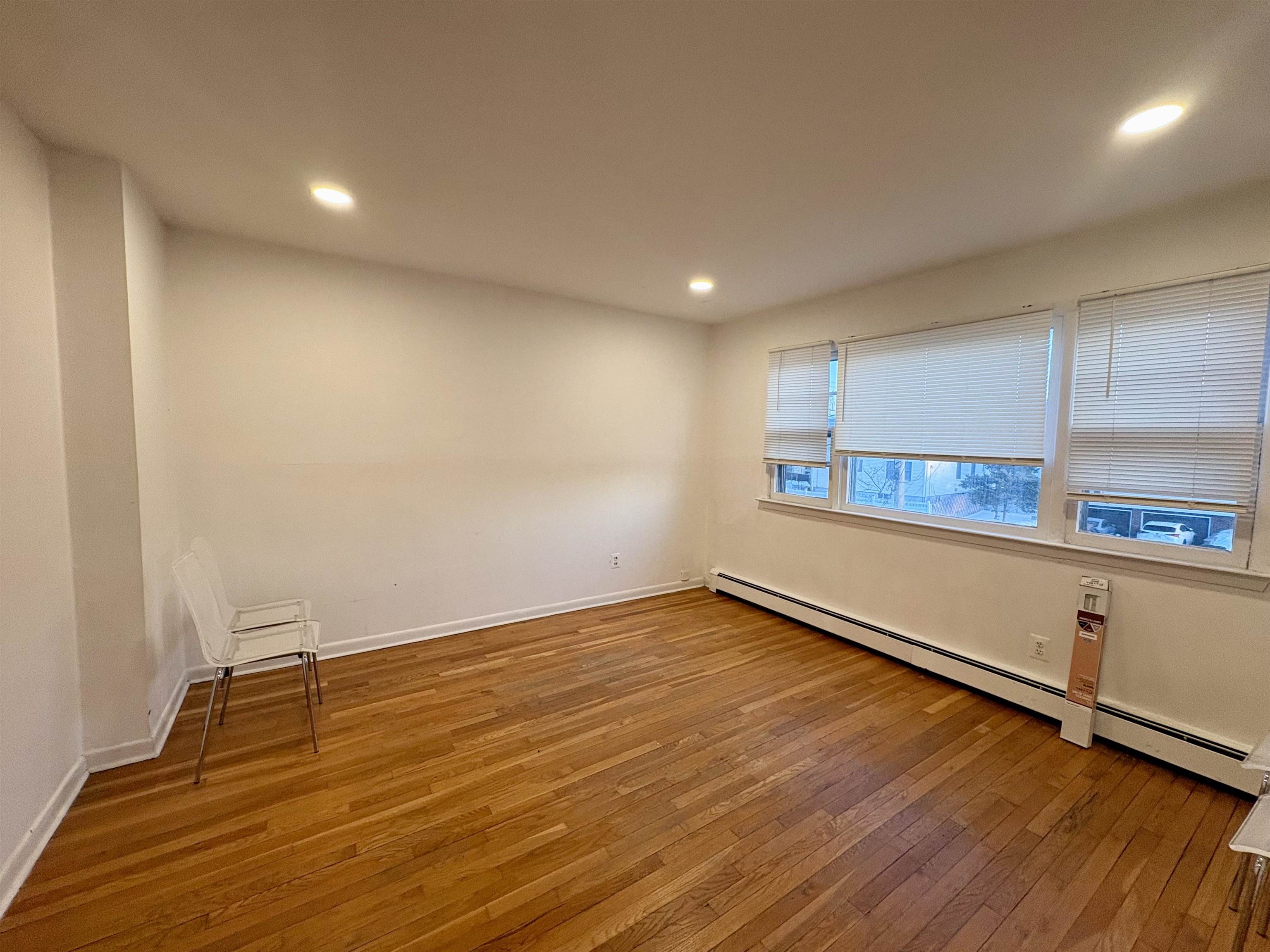 30 Kennedy Street, Unit 2 Hackensack, NJ 07601 - Photo 7 of 11 a view of a room with wooden floor and window