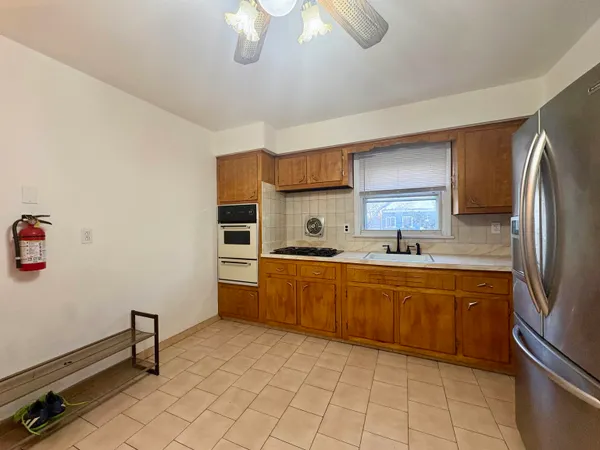 a kitchen with cabinets and stainless steel appliances