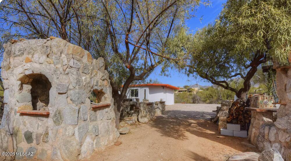 4415 North Swan Road Tucson, AZ 85718 - Photo 22 of 33 a view of a backyard with large trees