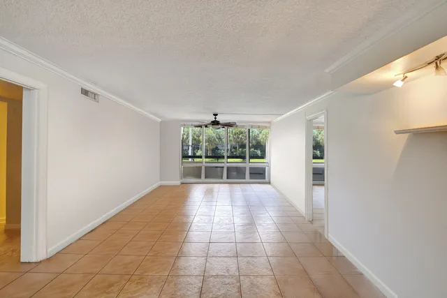 a view of a room with an empty room and windows