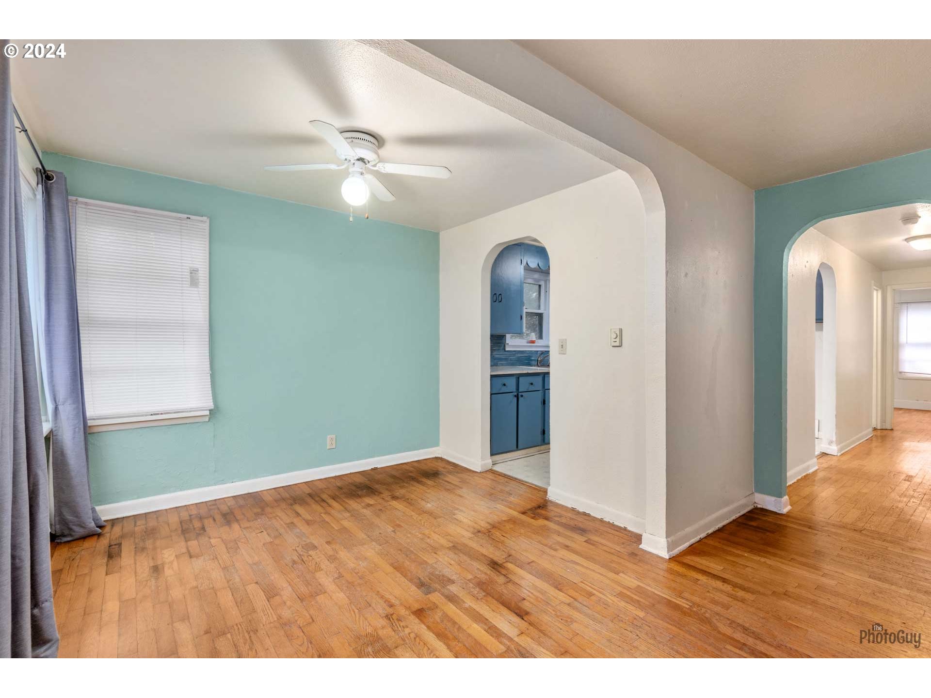 1148 18th Street Springfield, OR 97477 - Photo 8 of 32 a view of an empty room with window and wooden floor