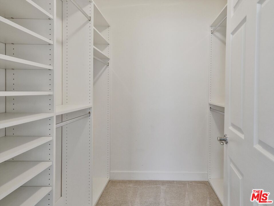937 12th Street, Unit 308 Santa Monica, CA 90403 - Photo 23 of 39 a view of walk in closet with empty racks