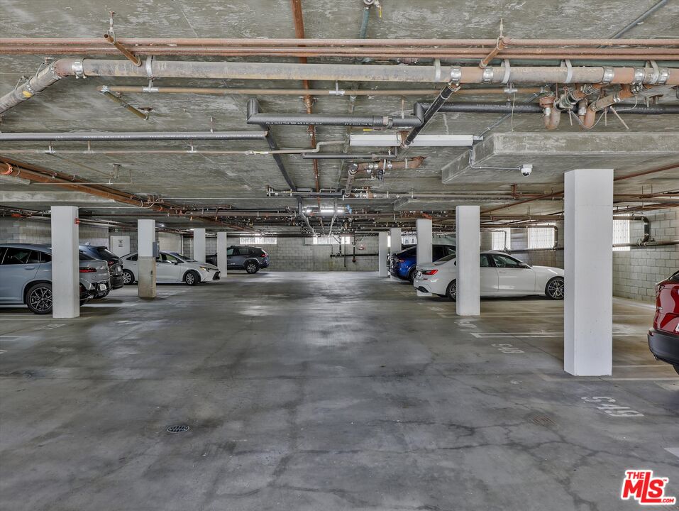 937 12th Street, Unit 308 Santa Monica, CA 90403 - Photo 25 of 39 a view of parking garage with cars