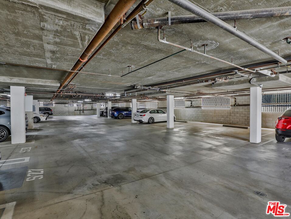 937 12th Street, Unit 308 Santa Monica, CA 90403 - Photo 26 of 39 a view of parking garage with cars
