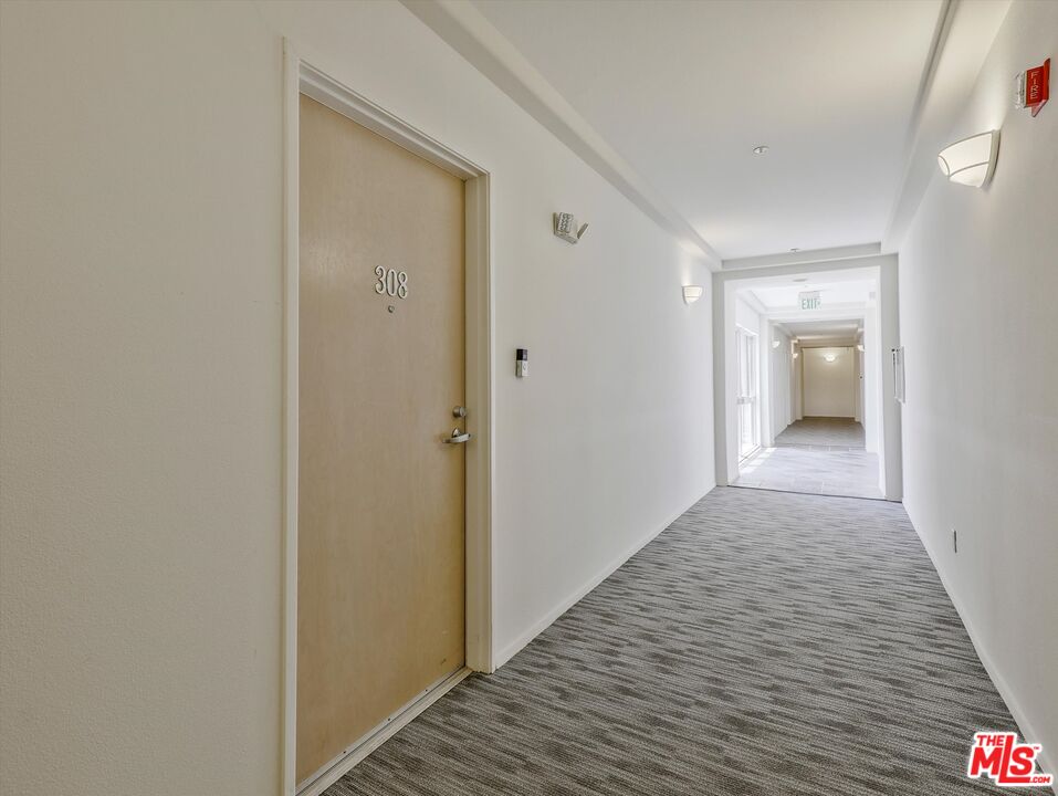 937 12th Street, Unit 308 Santa Monica, CA 90403 - Photo 4 of 39 a view of a hallway with wooden floor