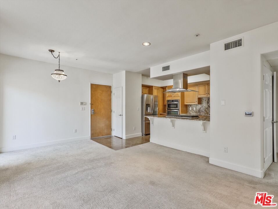 937 12th Street, Unit 308 Santa Monica, CA 90403 - Photo 8 of 39 a view of a room with window and hardwood