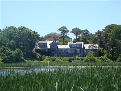 55 Strong Island Road Chatham, MA 02633 - Photo 1 of 16 a aerial view of a house with a yard