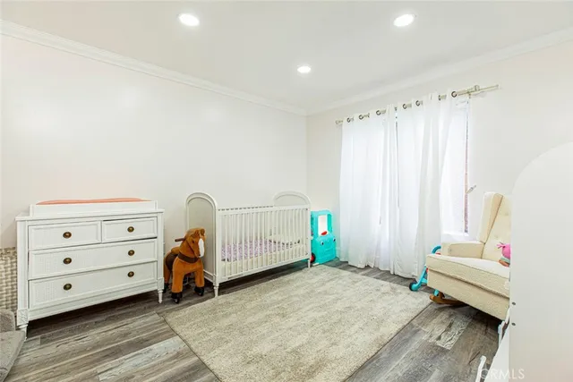 an aerial view of a house with a garden and a yard