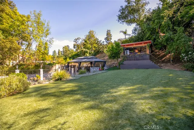a view of an chairs and table in the patio