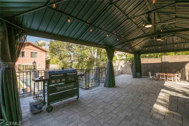 a view of a chairs and table in a patio