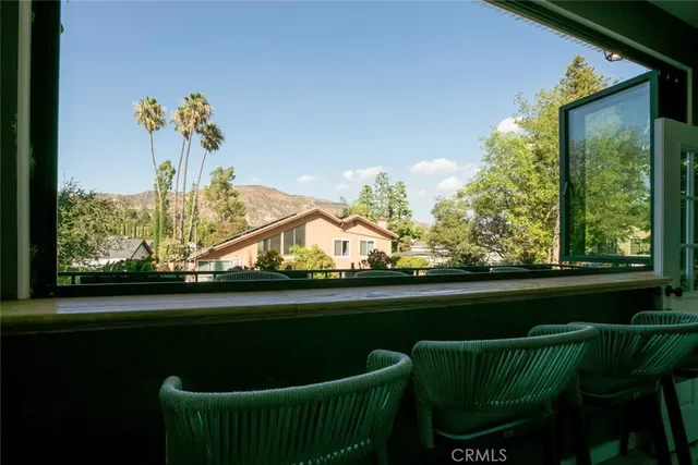 a view of a chairs and table in a room