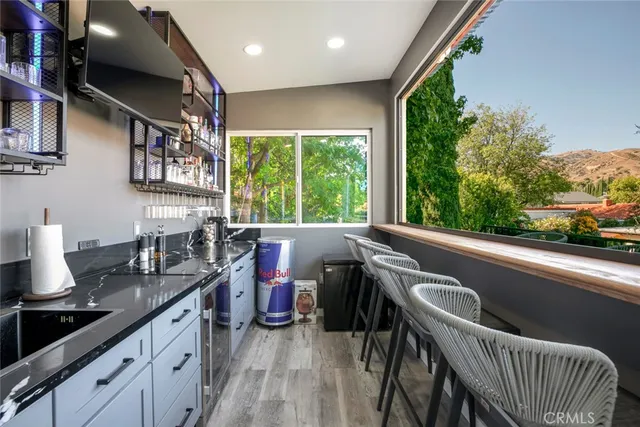 a dining room with furniture and a flat screen tv