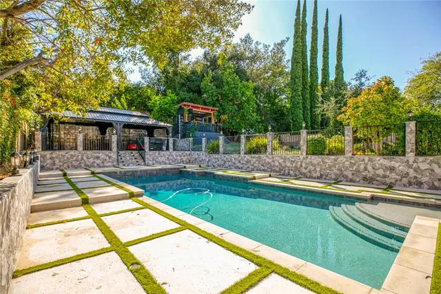 a view of path along with retail shop and buildings