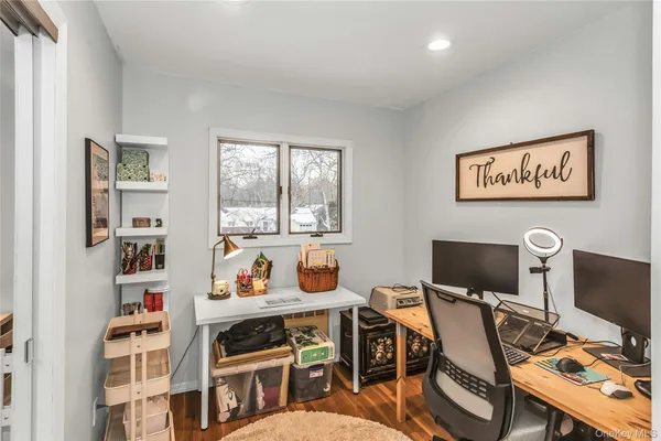 a workspace with furniture and bookshelf
