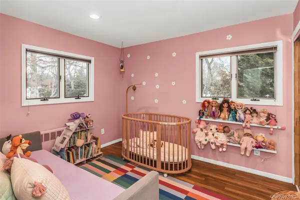 a bedroom with furniture and a window