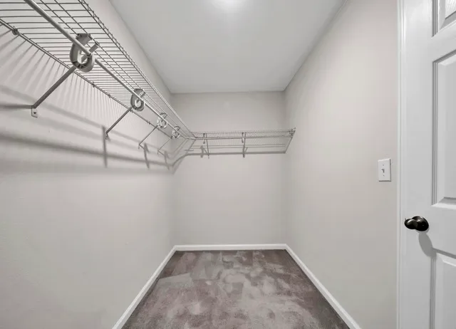 a view of a room with racks on the wall