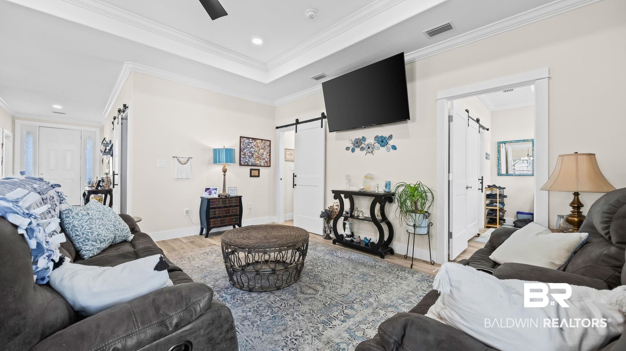 8013 Carmel Circle Foley, AL 36535 - Photo 8 of 49 Living room featuring a barn door, wood finished floors, ornamental molding, and recessed lighting