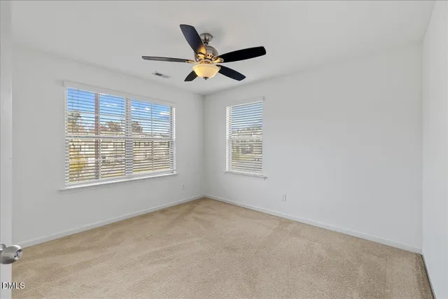 a bathroom with a granite countertop sink toilet a large mirror a shower and a bathtub