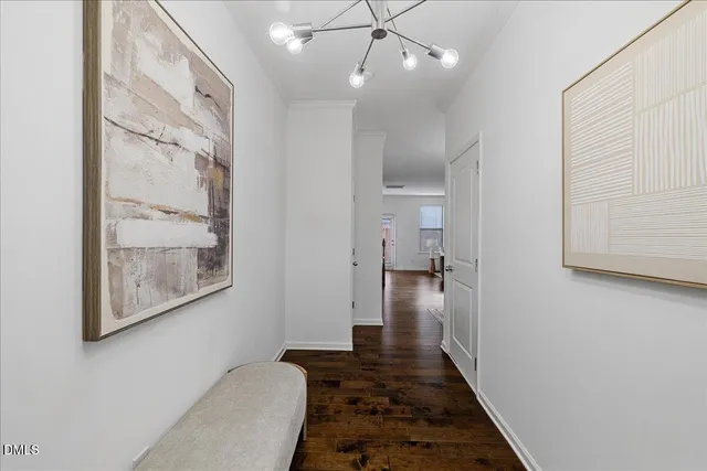 a view of a hallway view with wooden floor and staircase