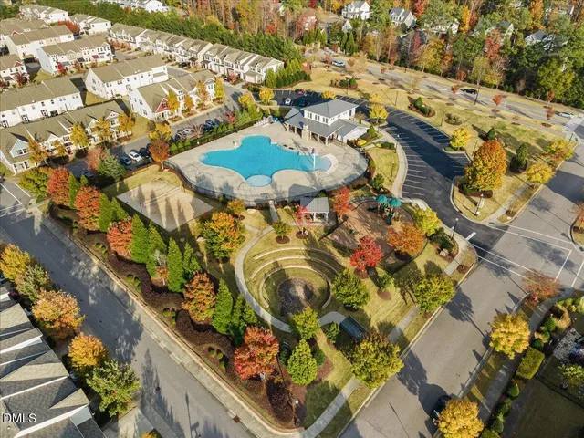 an aerial view of residential house with outdoor space and swimming pool