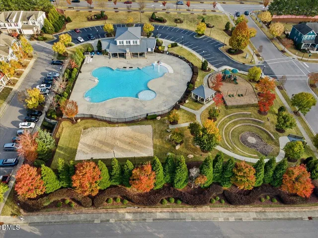 an aerial view of a residential apartment building with a yard