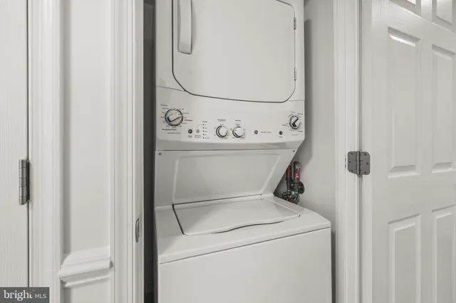 a kitchen with stainless steel appliances granite countertop a stove microwave and sink