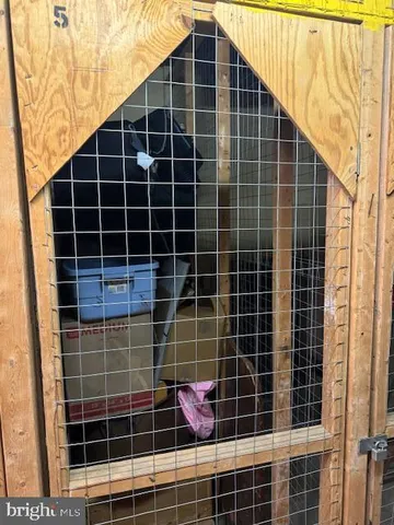 a view of a kitchen with a sink and cabinets