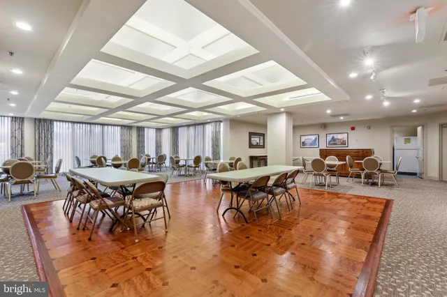 a view of a city with lush green forest