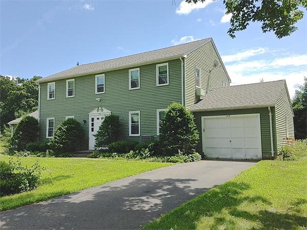 25 Plumtree Road Sunderland, MA 01375 - Photo 1 of 29 a front view of a house with a yard and garage