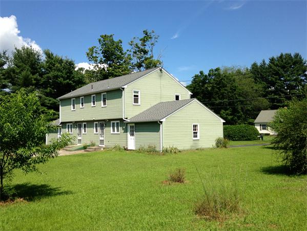 25 Plumtree Road Sunderland, MA 01375 - Photo 15 of 29 a front view of house with yard and green space