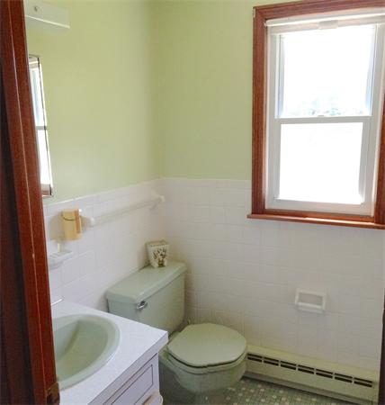 25 Plumtree Road Sunderland, MA 01375 - Photo 9 of 29 a white toilet sitting next to a window and vanity