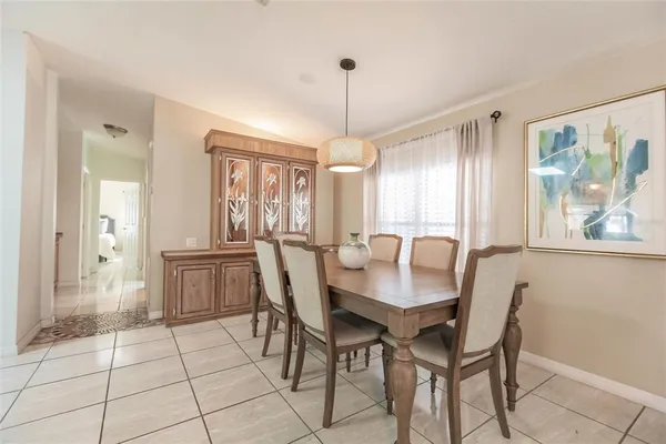 a dining room with furniture and window