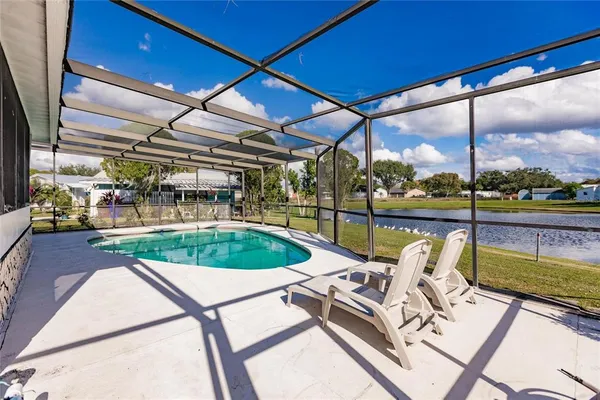 a view of a swimming pool with a patio