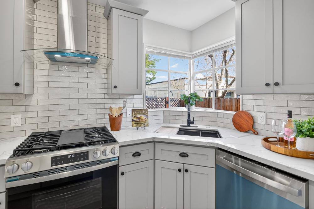 2008 Argail Way Sacramento, CA 95822 - Photo 19 of 53 a kitchen with a sink stove and cabinets