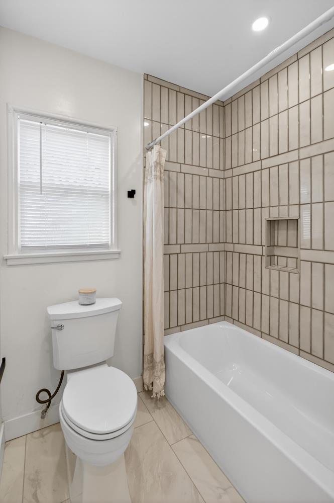 2008 Argail Way Sacramento, CA 95822 - Photo 24 of 53 a bathroom with a toilet and a shower